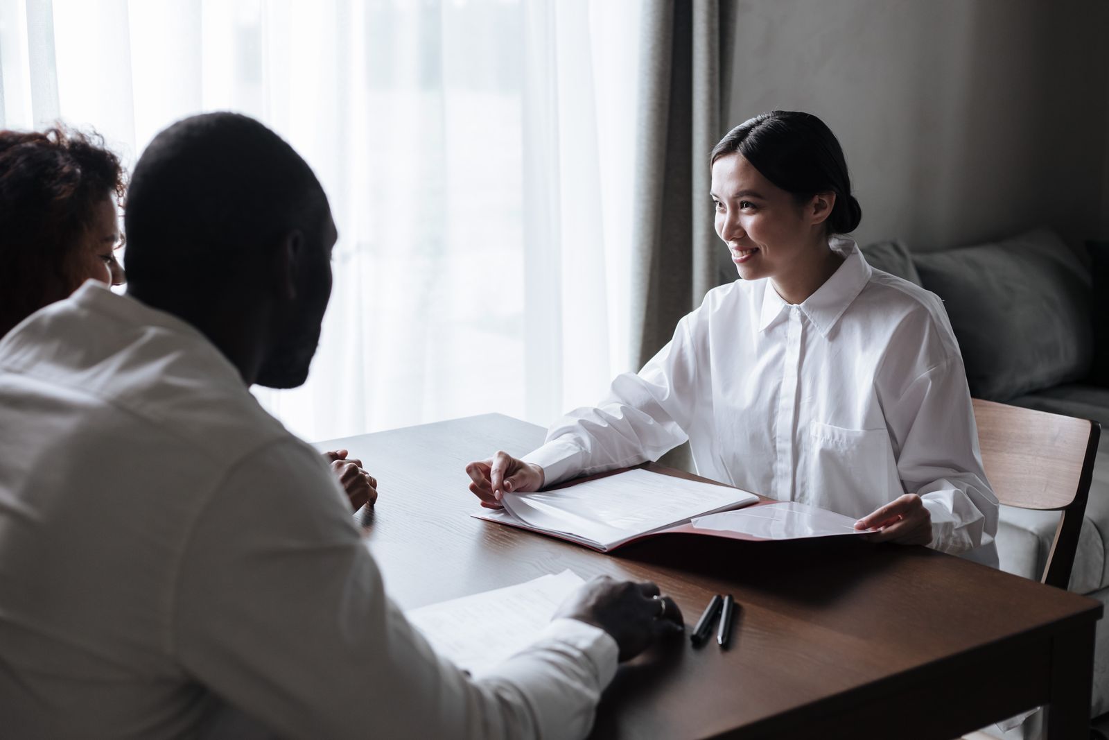 People discussing documents together at a table